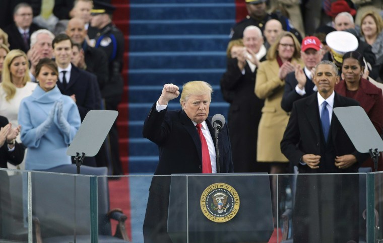 Image: Trump pumps his fist after addressing the crowd