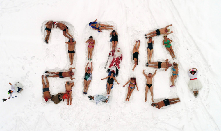 Image: Members of the Cryophile winter swimming club form 2018 on the bank of the Yenisei River