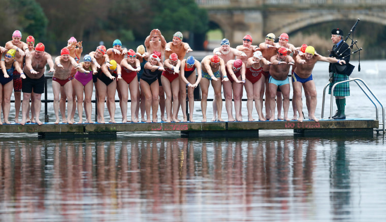 Image: Swimmers prepare to take part in the Christmas Day Serpentine swim in Hyde Park, London