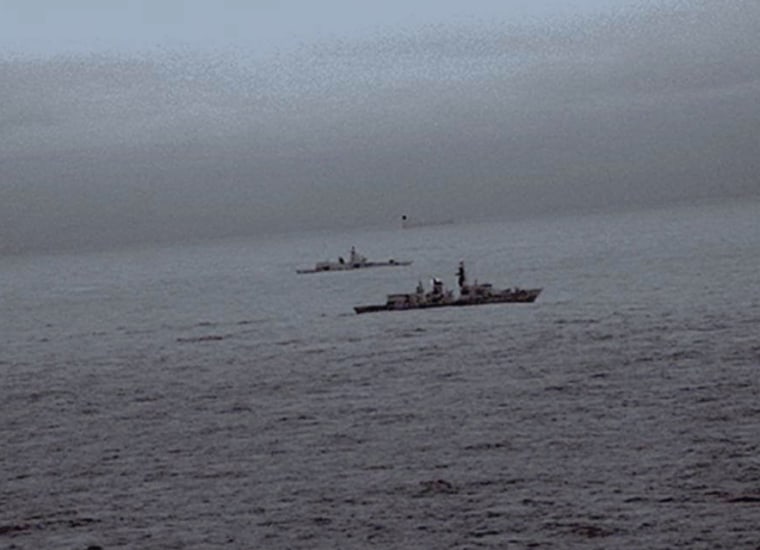 Image: Images from an infrared camera on a helicopter show Royal Navy frigate HMS St Albans escorting Russian warship Admiral Gorshkov as it passes close to UK territorial waters through the North Sea in an image from an infrared camera on a helicopter ha