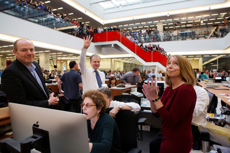 Image: In 2013, publisher Arthur O. Sulzberger Jr. holds up four fingers to indicate the four Pulitzer Prizes won by The New York Times in 2013.