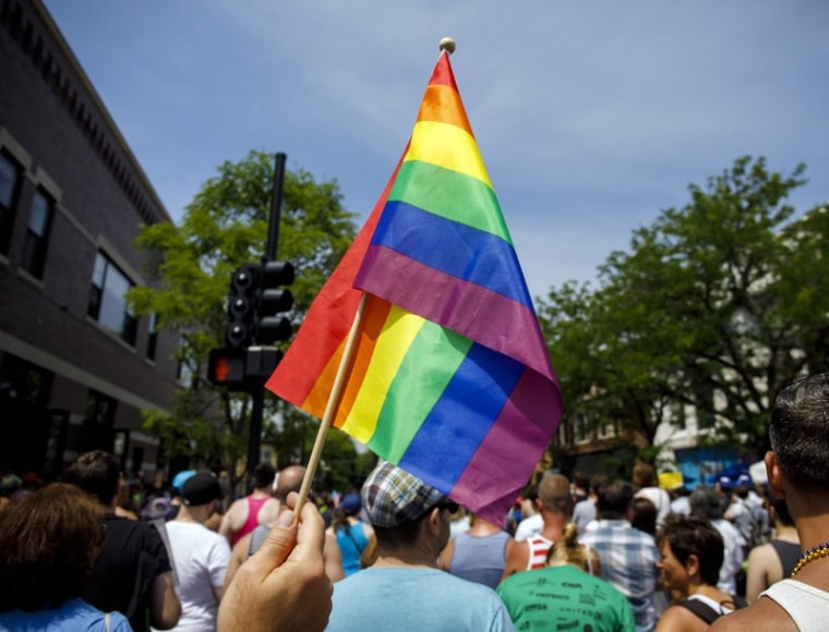 In this June 11, 2017 file photo people attend the LGBTQ Chicago Equality rally in the Andersonville neighborhood of Chicago. 