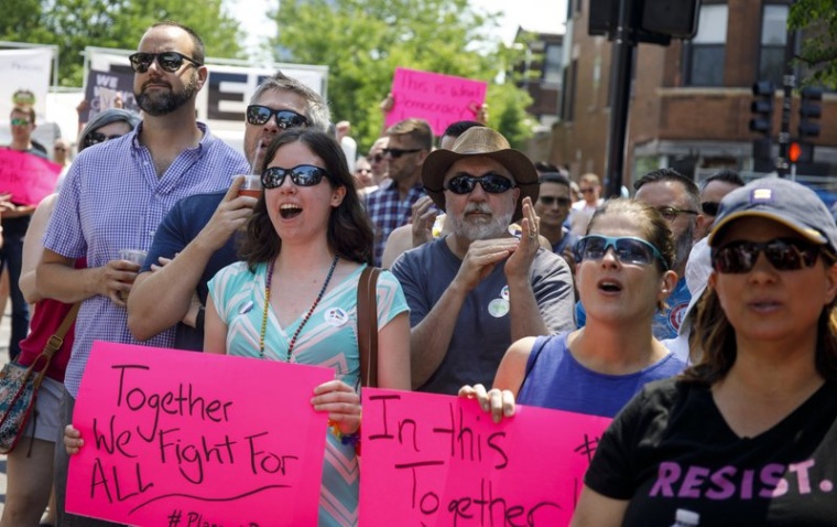 In this June 11, 2017 file photo, people attend the LGBTQ Chicago Equality rally in the Andersonville neighborhood of Chicago. 