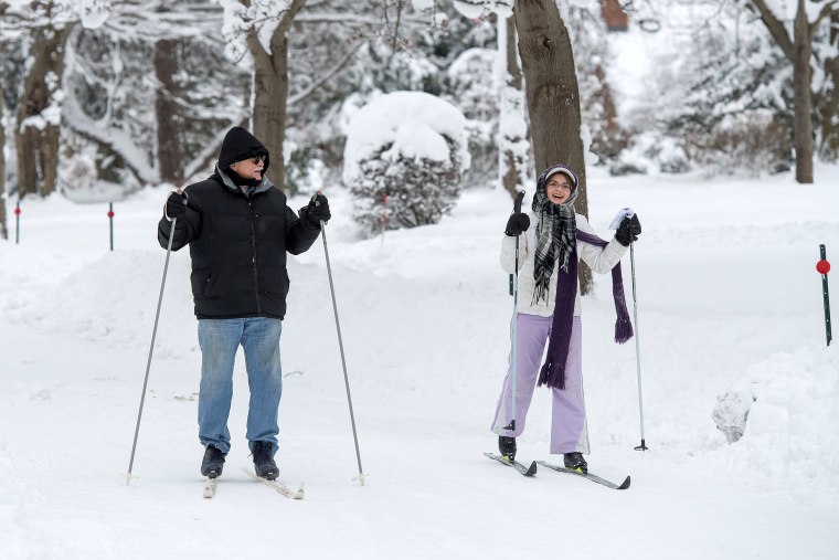 Image: Joe and Grace Ferrera cross country ski on South Shore Drive in Erie,