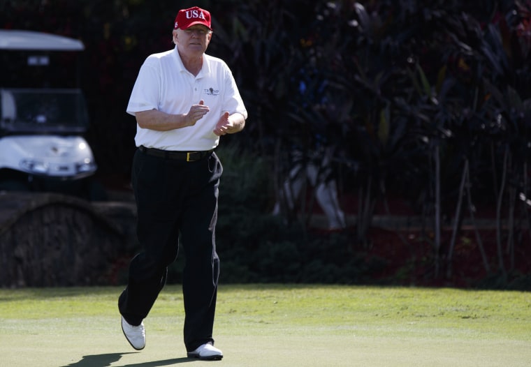 Image: Donald Trump arrives to meet with members of the U.S. Coast Guard, who he invited to play golf