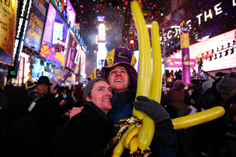 Image: A couple embraces while they celebrate the New Year in Times Square in New York