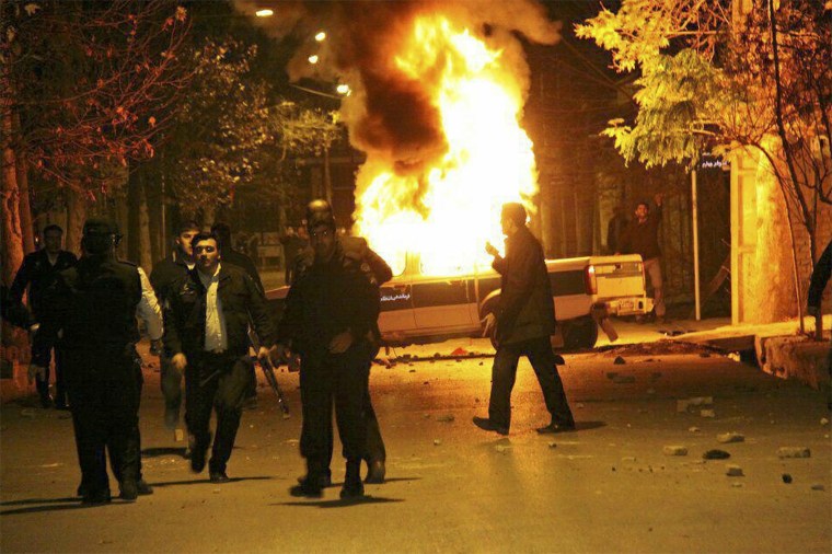 A vehicle burns as demonstrators protested high prices and the poor state of the economy in Dorud, in Iran's Lorestan province, on Dec. 30.