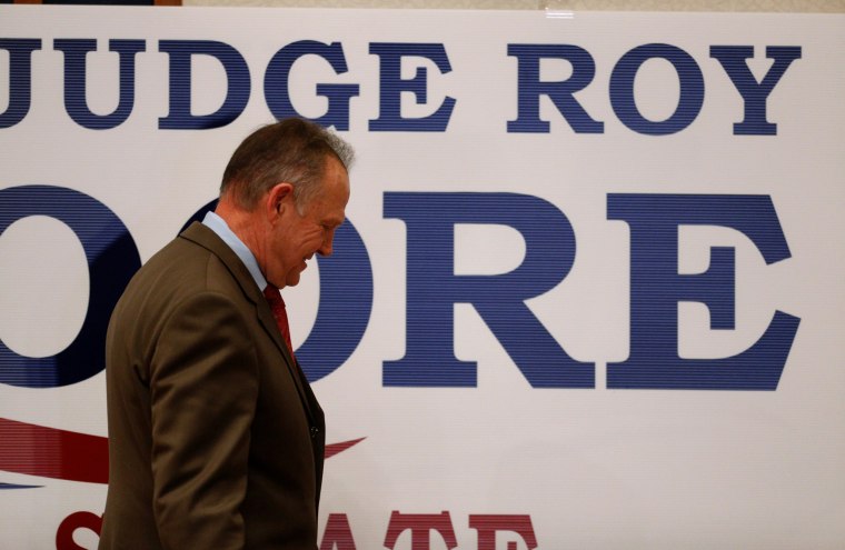 Image: Republican U.S. Senate candidate Roy Moore exits the stage after addressing supporters at his election night party in Montgomery