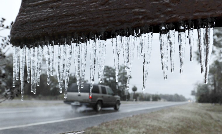 Image: Icicles hang from a sign in Hilliard, Florida