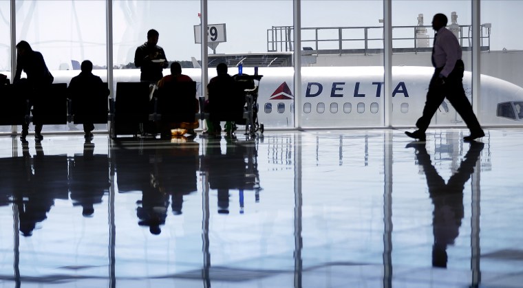 Image: A Delta Air Lines jet sits at a gate at Hartsfield-Jackson Atlanta International Airport, in Atlanta on Oct. 13, 2016.