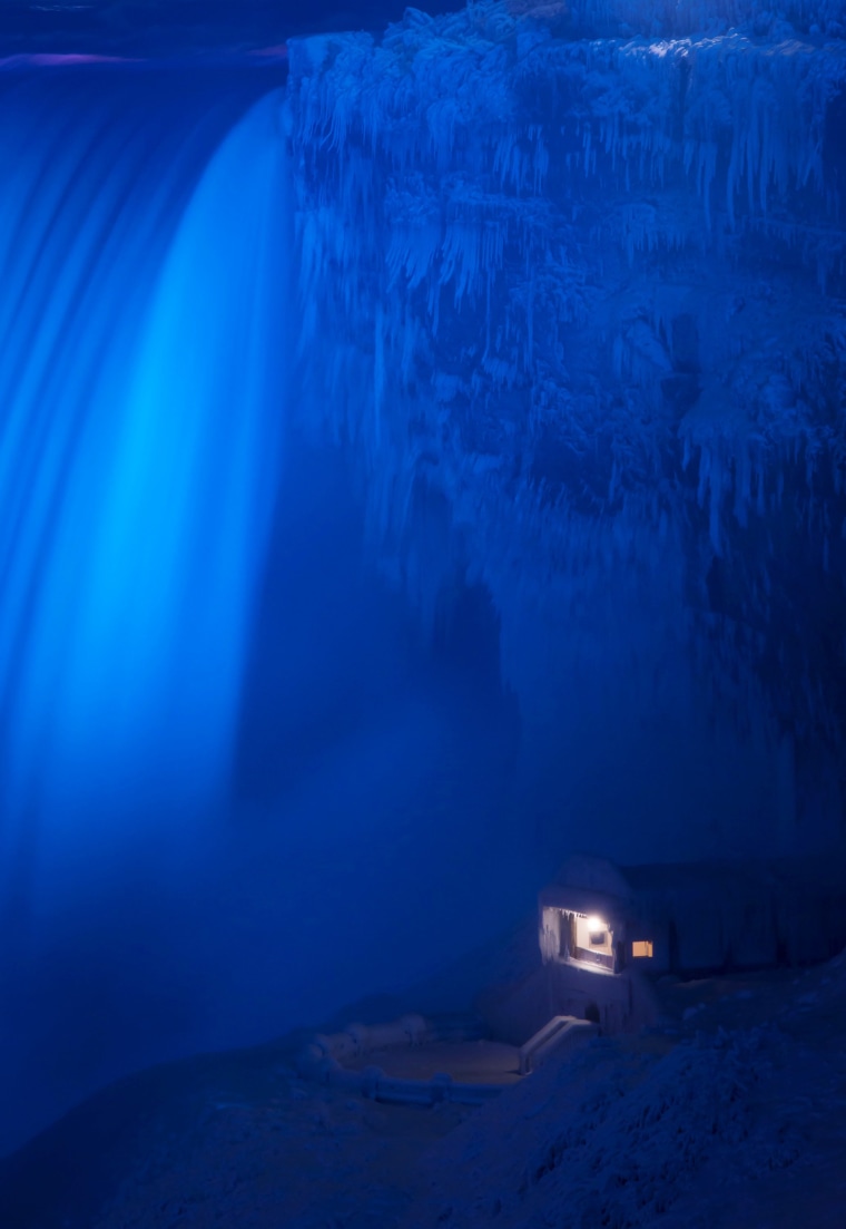 Image: A building covered in ice sits at the base of the Horseshoe Falls in Niagara Falls