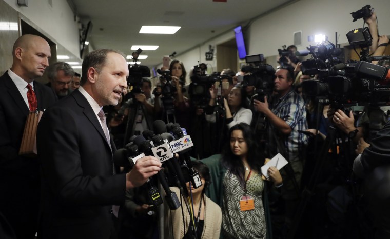 Image: A San Francisco public defender answers questions after a verdict was reached in the trial of Jose Ines Garcia Zarate