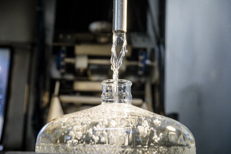Image: Unfiltered, untreated, unsterilized spring water flows into a bottle at Opal Springs Water Company in Culver, Ore.