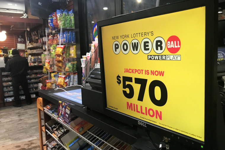 Image: A Powerball sign is pictured in a store in New York City