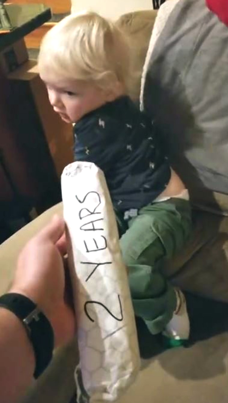 Dad measures his sons growth with burritos!