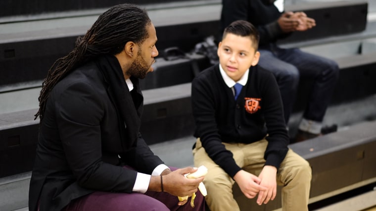 Nearly 600 volunteer mentors show up for school breakfast with dads