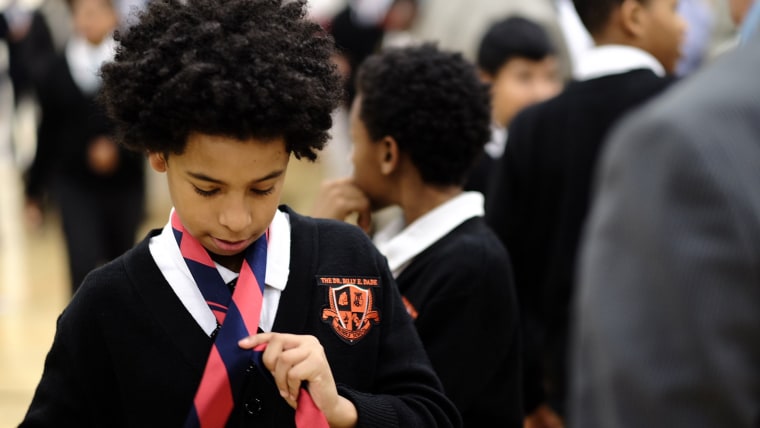 Nearly 600 volunteer mentors show up for school breakfast with dad