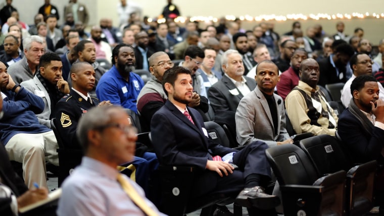 Nearly 600 volunteer mentors show up for school breakfast with dads