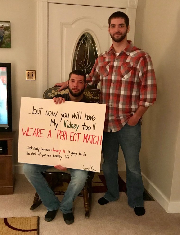 Brandon and Derek pose with Brandon's surprising birthday card.