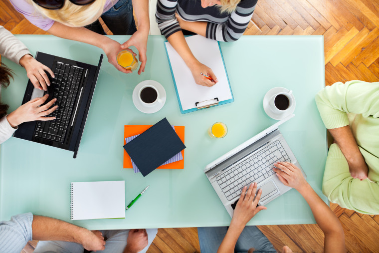 Image: Group of people with two laptops at a meeting