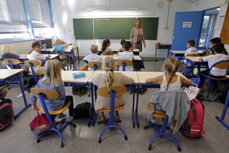 Image: Schoolchildren in a class.