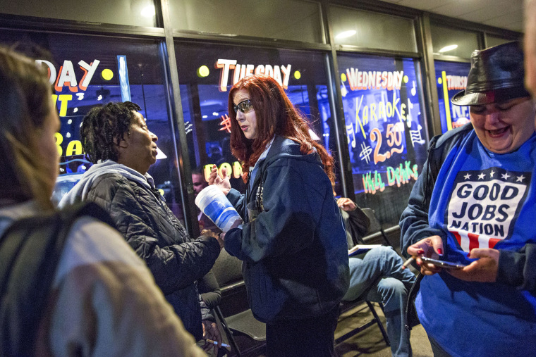 Image: Renee Elliott, a press operator at Carrier Corp., chats with colleagues after participating in a "The State of the Working Class" event, sponsored by Good Jobs Nation, in Indianapolis, Indiana, on Wednesday, Jan. 10, 2018.