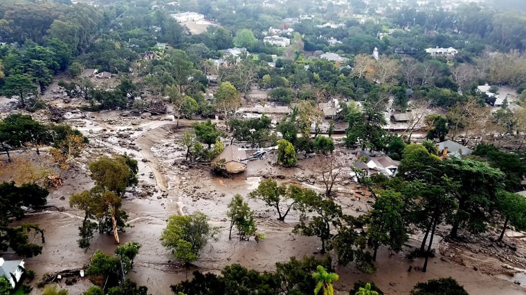 Image: Mudflow and damage from mudslides are pictured in this aerial photo taken from a Santa Barbara County Air Support Unit Fire Copter over Montecito