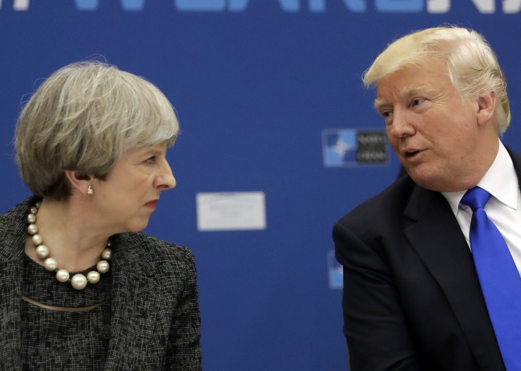 President Donald Trump, right, speaks to British Prime Minister Theresa May during in a working dinner meeting at the NATO headquarters during a NATO summit of heads of state and government in Brussels on May 25, 2017.