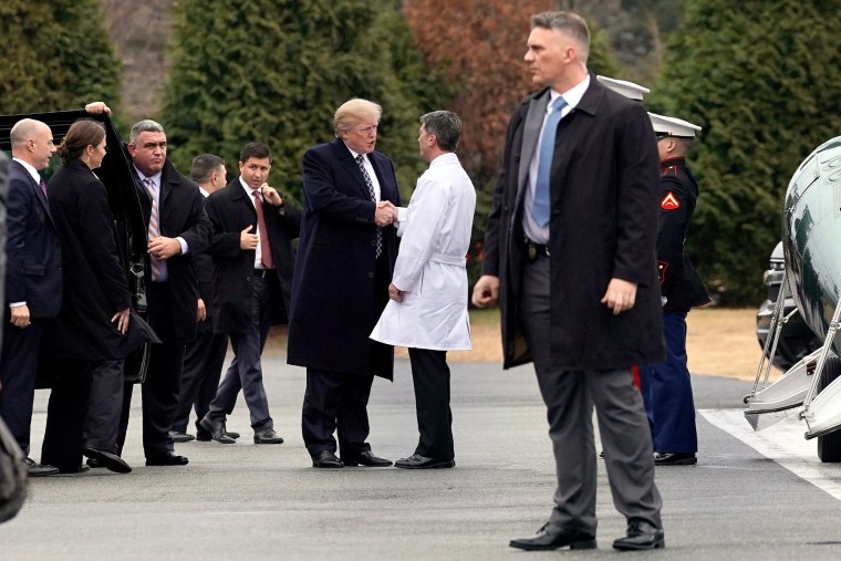 Image: U.S. President Donald Trump shakes hands with Dr. Ronny Jackson after his annual physical exam at Walter Reed National Military Medical Center in Bethesda