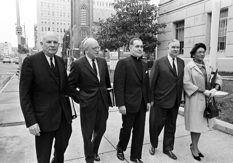 Members of the U.S. Commission on Civil Rights arrive at the Federal building in Jackson, February 10, 1965 to open a hearing concerning denials of voting rights and discrimination of justice. From left are, John A. Hannah, chairman, Robert S. Rankin, Rev. Theodore M. Hesburgh, Erwin N. Griswold and Mrs. Frankie Muse Freeman.