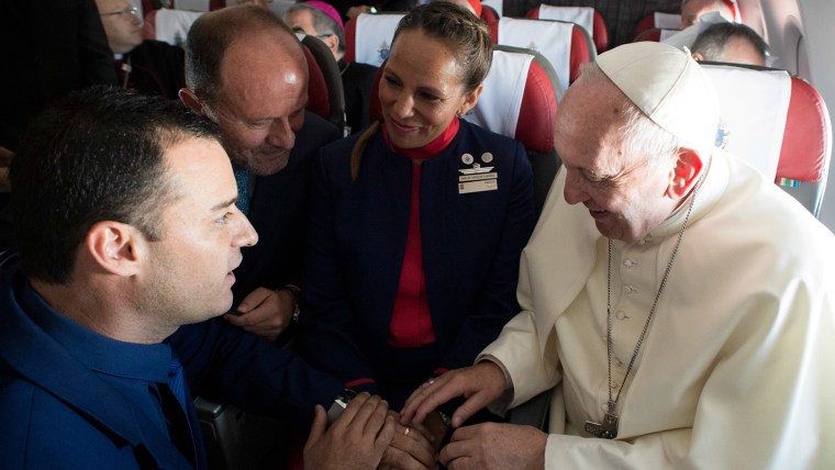 Pope Francis performs wedding ceremony for flight attendants on flight in Chile