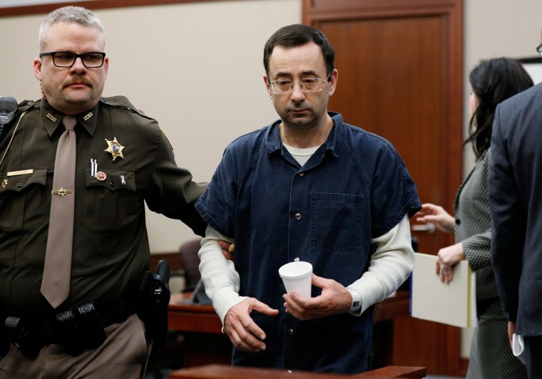 Image: Former team USA Gymnastics doctor Larry Nassar is escorted by a court officer during his sentencing hearing in Lansing