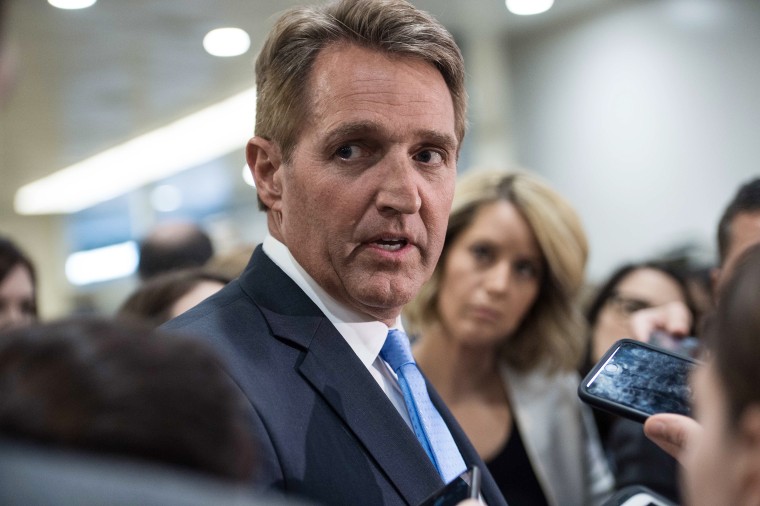 Image: Jeff Flake speaks to reporters