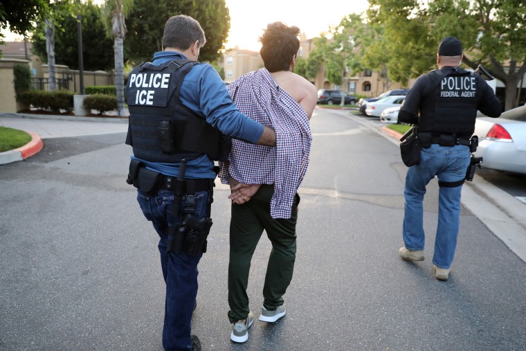 Image: An ICE agent arrests an Iranian immigrant in San Clemente, Calif.