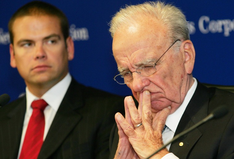 Image: Rupert Murdoch (R), chairman of media he