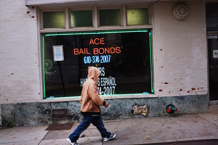 Image: A man walks by a bail bonds store on Oct. 20, 2011 in Reading, Pennsylvania.