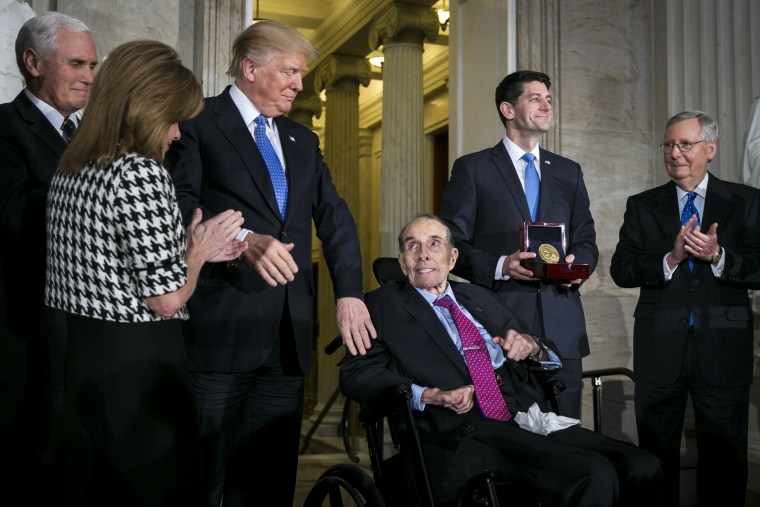 Image: President Donald Trump greets Dole as he is presented with the congressional Gold Medal