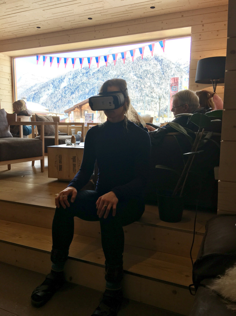 Laurenne Ross uses a VR headset in a hotel lobby in St. Mortiz during the 2016 World Championships, prior to her injury.