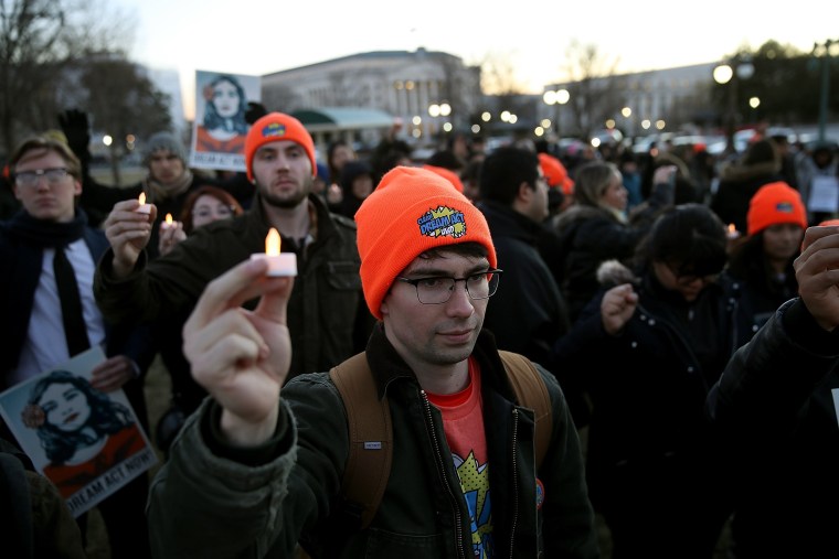 Image: Protesters advocating for the DREAM Act hold a candlelight vigil