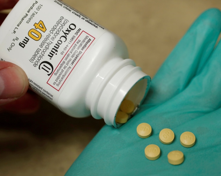 Image: FILE PHOTO: A pharmacist holds prescription painkiller OxyContin at a local pharmacy in Provo