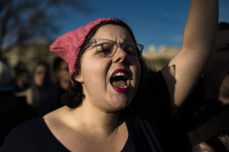 Image: A demonstrator shouts slogans in front of the White House.