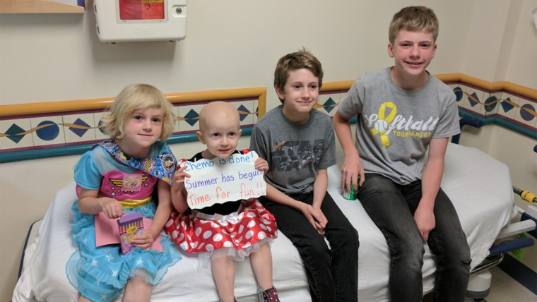 Teig Harris, now cancer free, gets her first haircut at the age of four after years of chemo therapy.