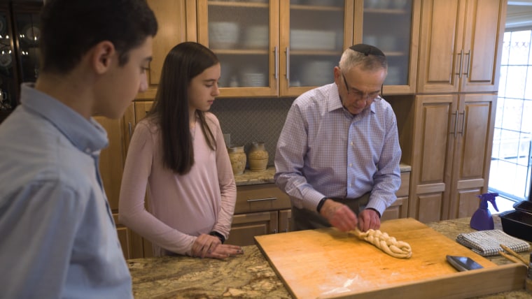 Nat Shaffir makes challah bread with two of his 12 grandchildren, 17-year-old Benji Wilbur and 14-year-old Kira Wilbur. "He's funny and he likes to smile a lot," Kira says of her Saba (grandfather).