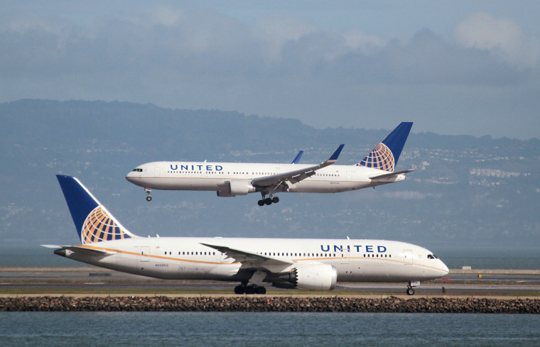 Image: A United Airlines 787 taxis as a United Airlines 767 lands at San Francisco International Airport