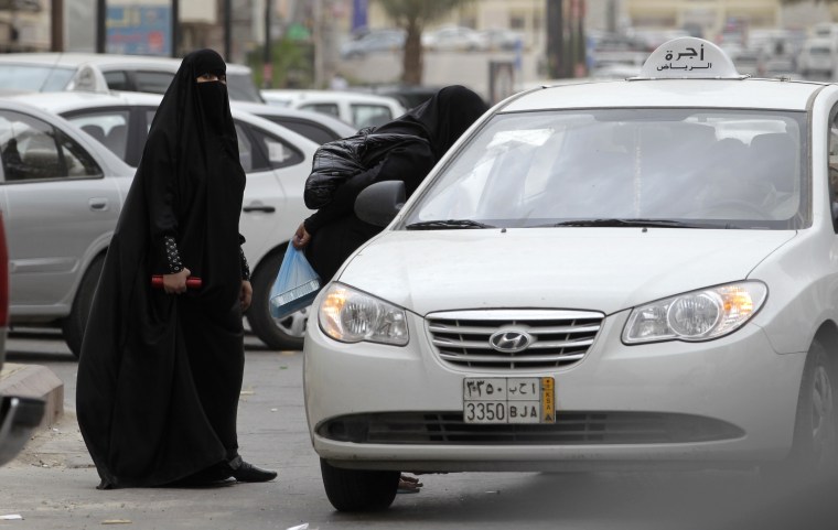 Image: Saudi women board a taxi in Riyadh.