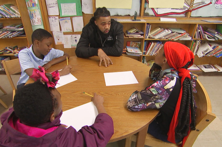 Image: Aaron Maybin speaks to students at Matthew A. Henson Elementary School in Baltimore.