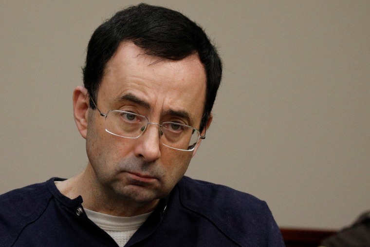 Image: Larry Nassar, a former team USA Gymnastics doctor who pleaded guilty in November 2017 to sexual assault charges, sits in the courtroom during his sentencing hearing in Lansing, Michigan