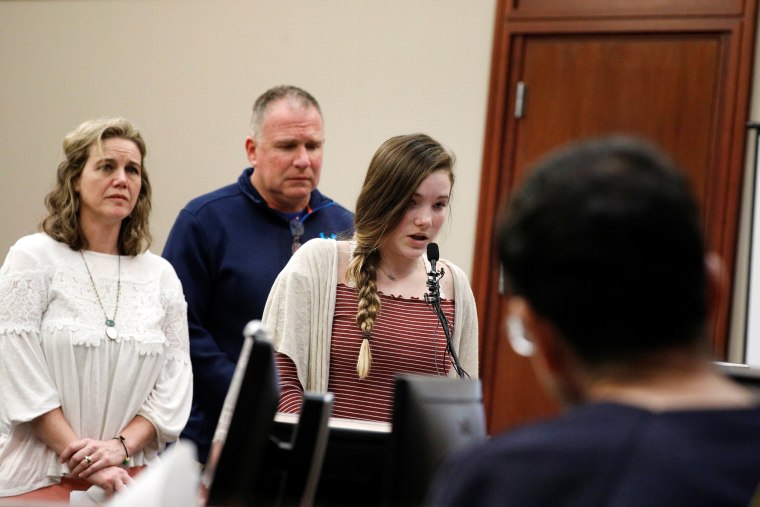 Image: Victim Jillian Swinehart speaks at the sentencing hearing for Larry Nassar, (R) a former team USA Gymnastics doctor who pleaded guilty in November 2017 to sexual assault charges, in Lansing, Michigan