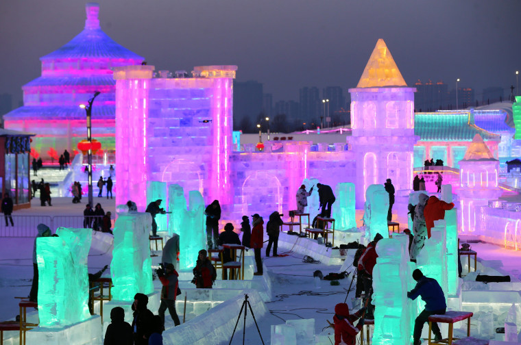 Giant ice sculptures glow in hot neon at winter festival in Harbin, China