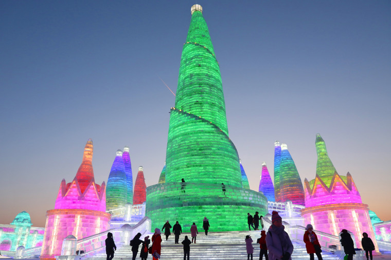 Giant ice sculptures glow in hot neon at winter festival in Harbin, China